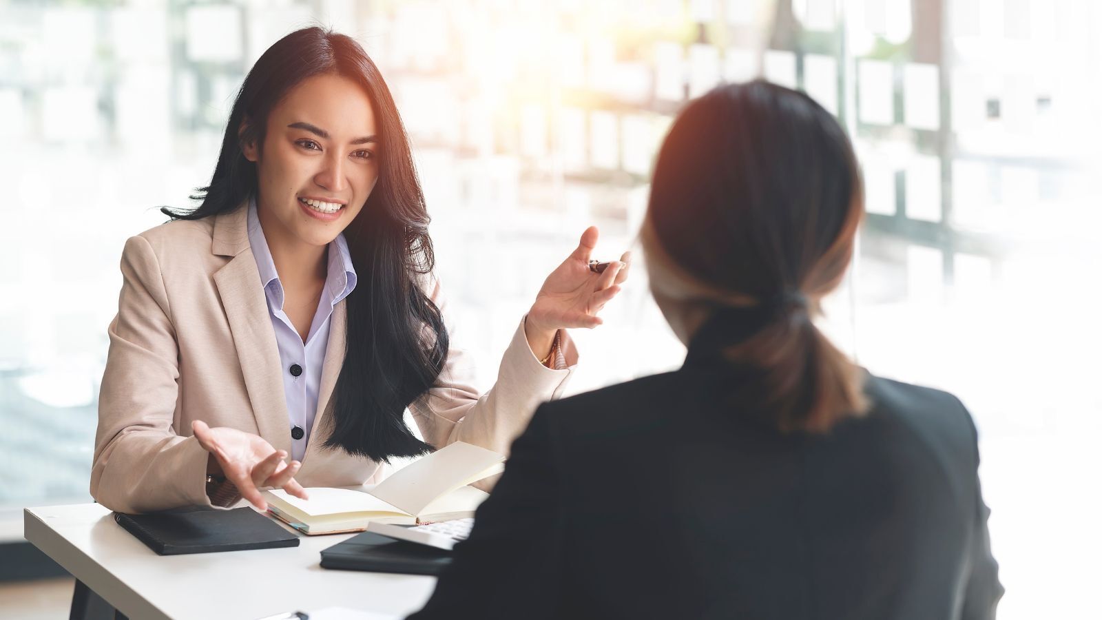 two females having a conversation about how AI legal drafting works